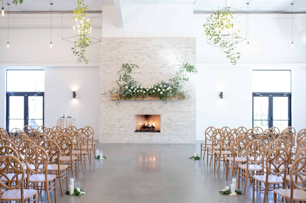 ceremony site with white and green floral arrangements at the Maxwell Raleigh