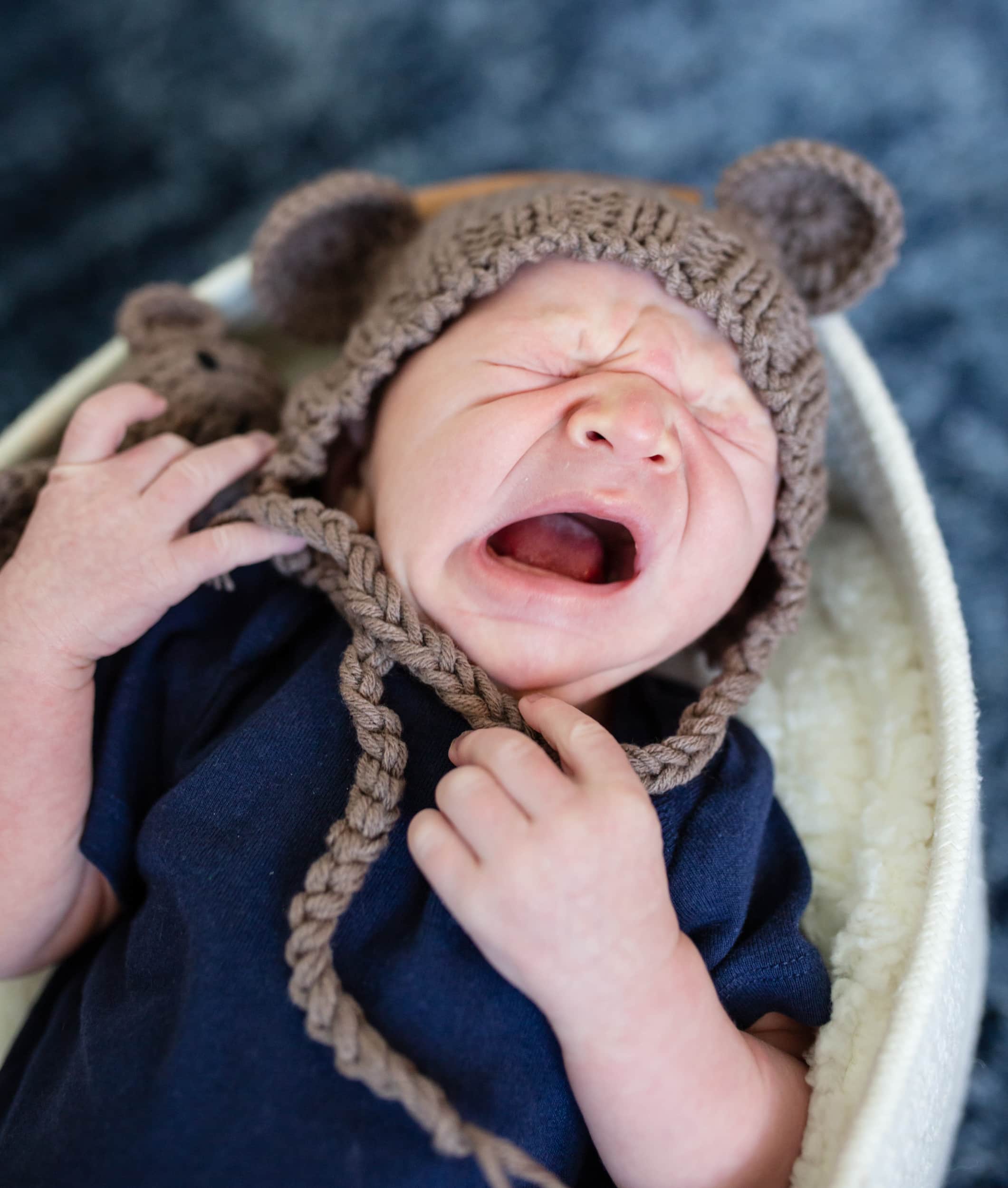 yawning newborn baby by raleigh newborn photographer