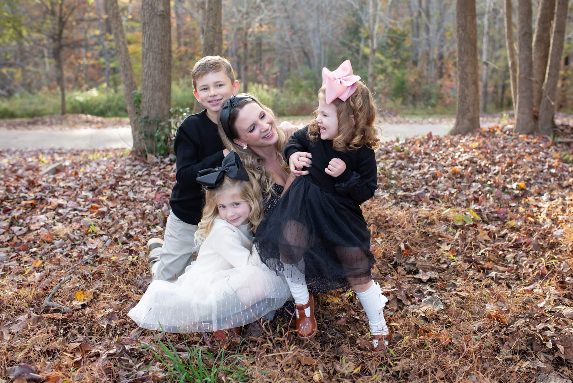 mother playing with her children during fall photo session in Wake Forest, NC