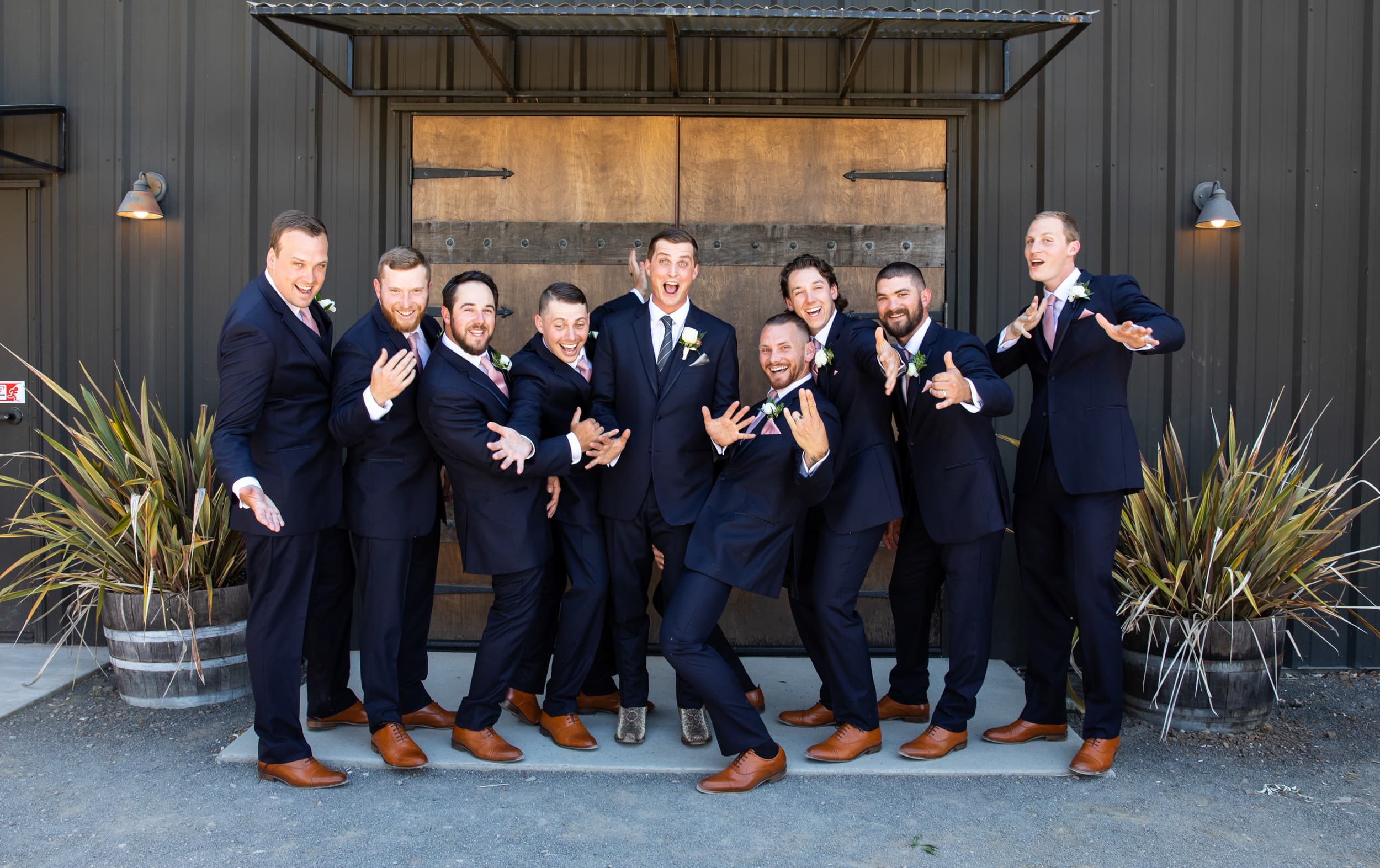 groom and groomsmen posing for a silly photo
