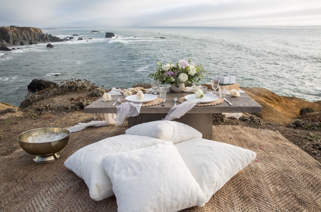 picnic engagement session setup by the ocean. location of your engagement photos
