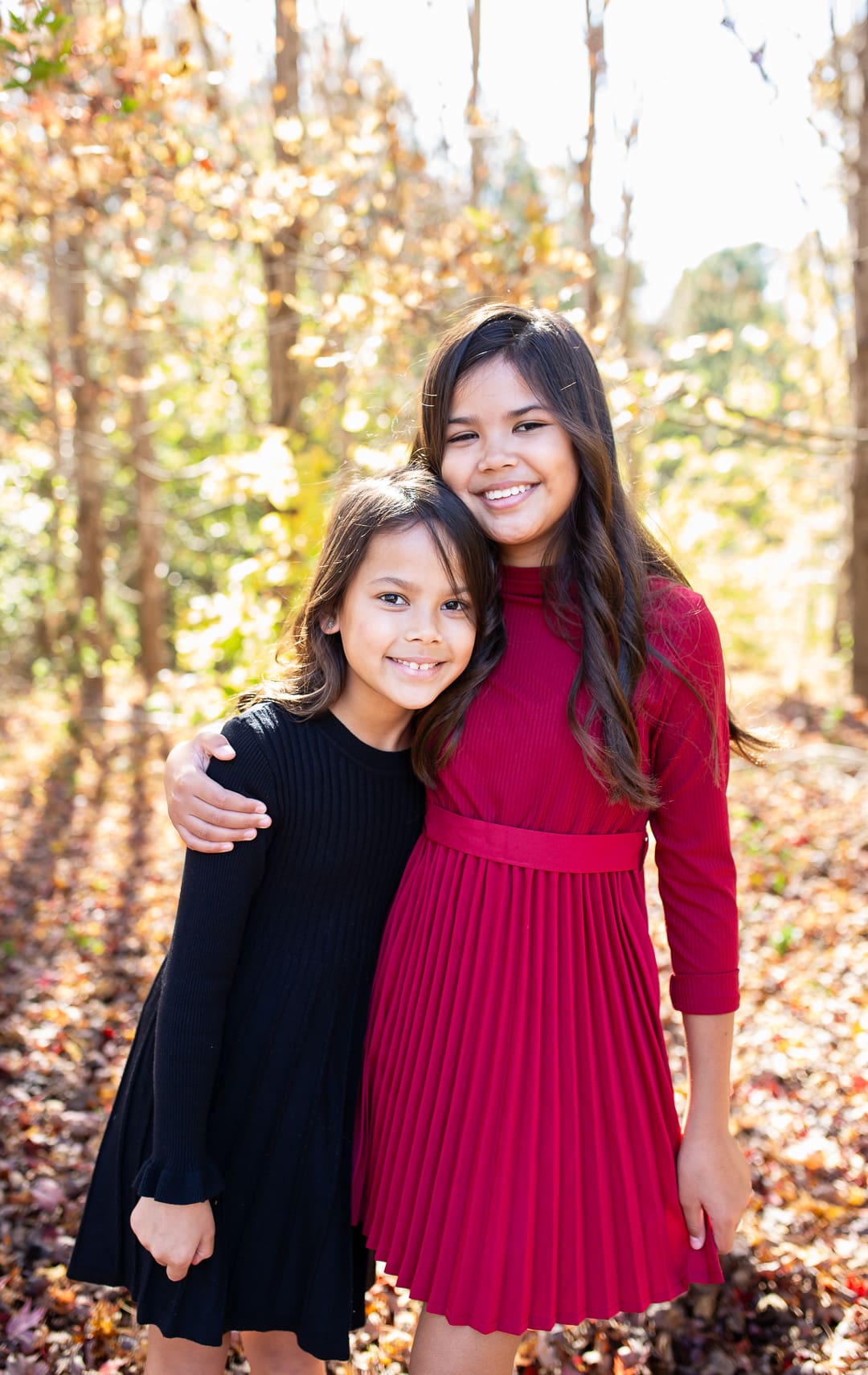 two sisters hugging during family photos in wake forest, nc.
wake forest mini sessions