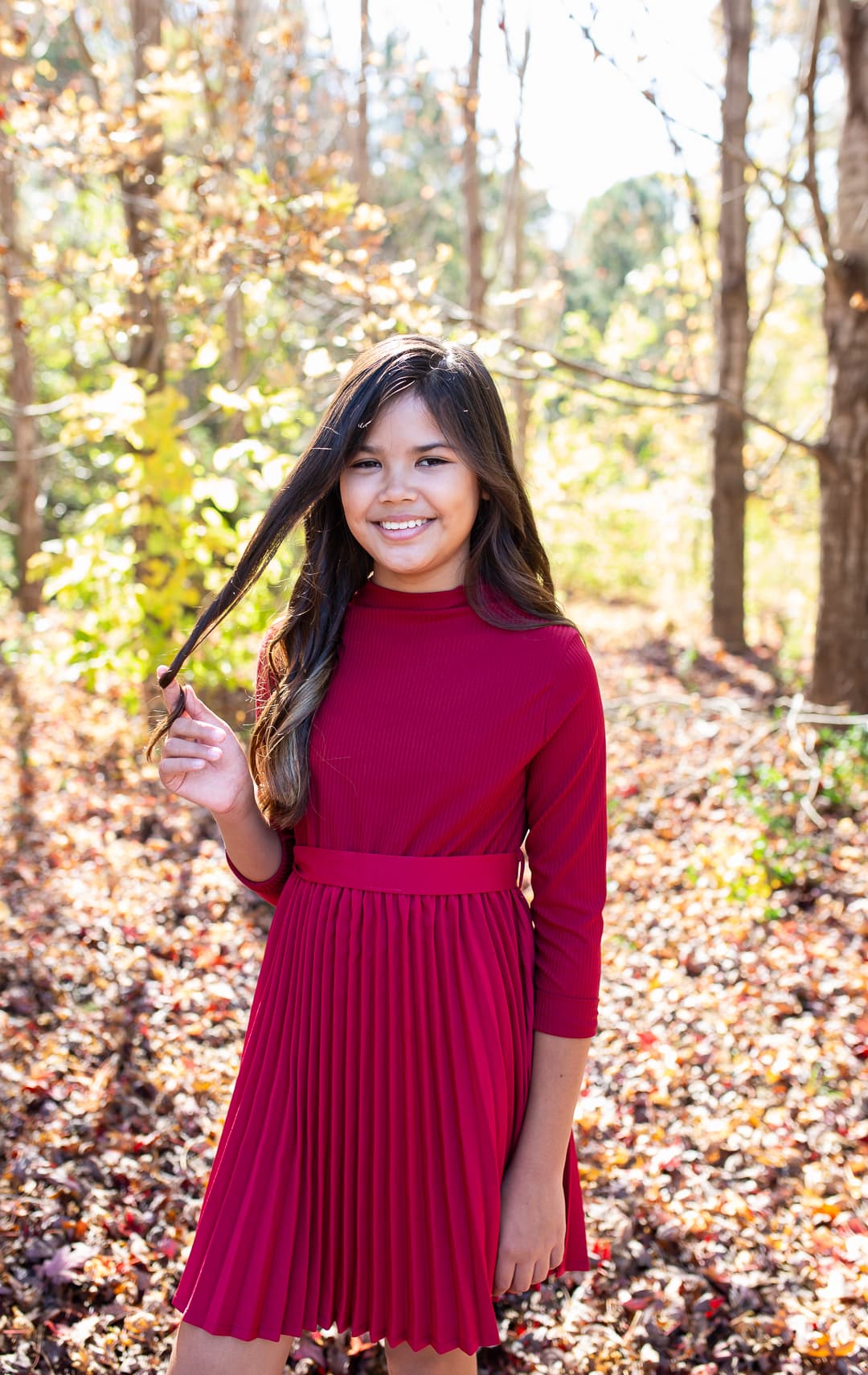 smiling girl wearing a red dress