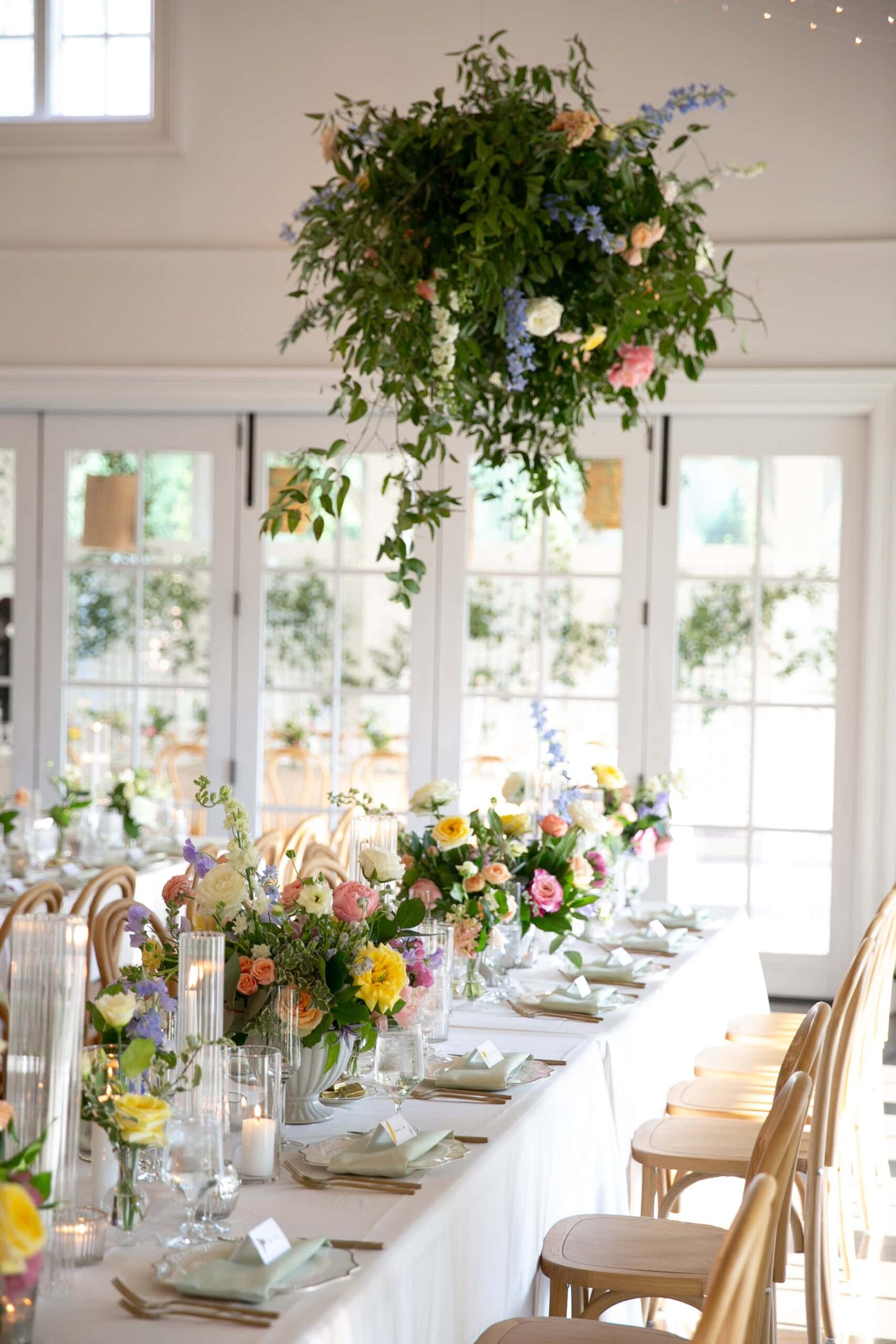 Lush pastel florals at the Carriage House at Merrimon-Wynne wedding venue in Raleigh, NC. Spring wedding decor captured by raleigh wedding photographer.