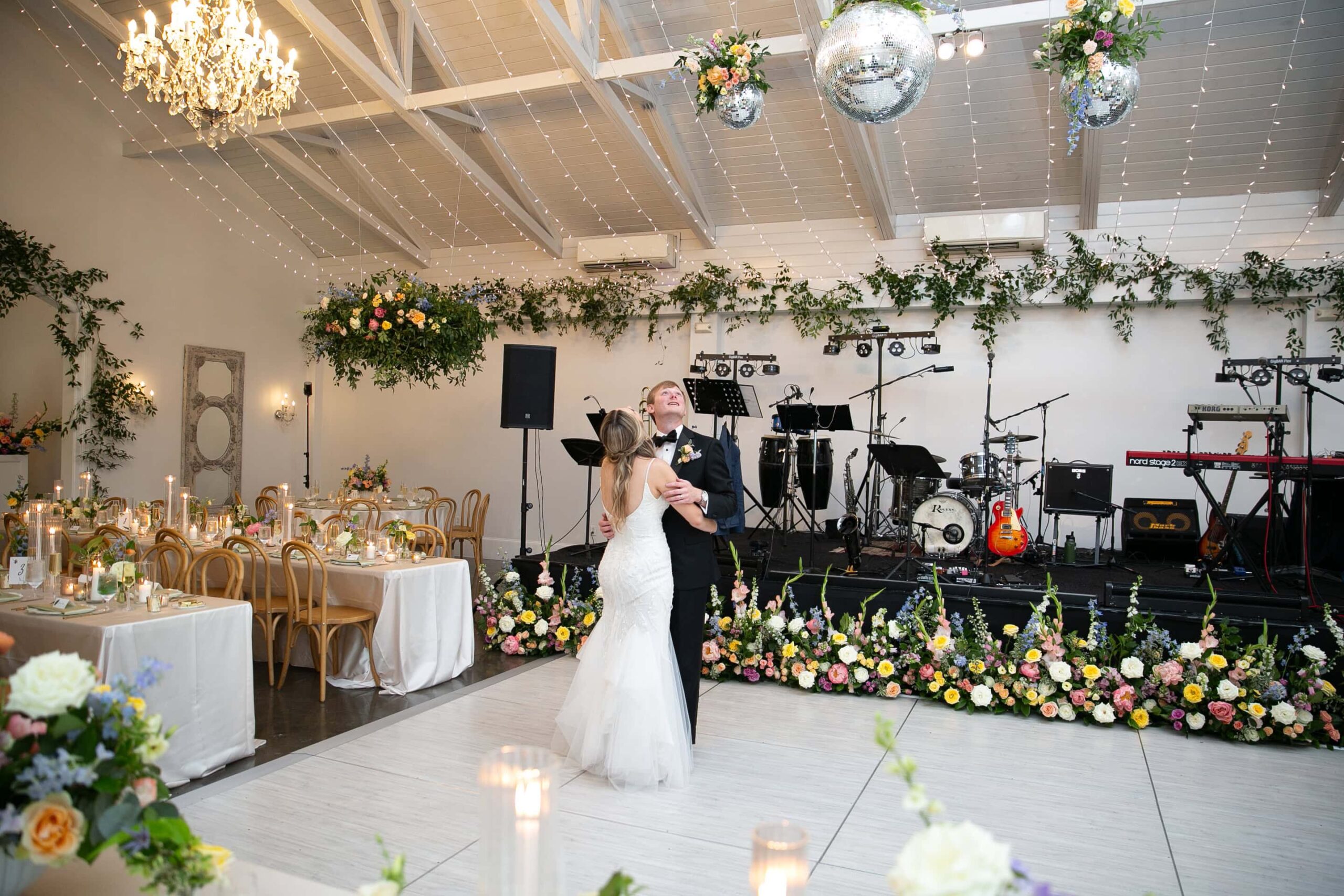 bride and groom admiring their wedding reception design at the Merrimon-Wynne in Raleigh