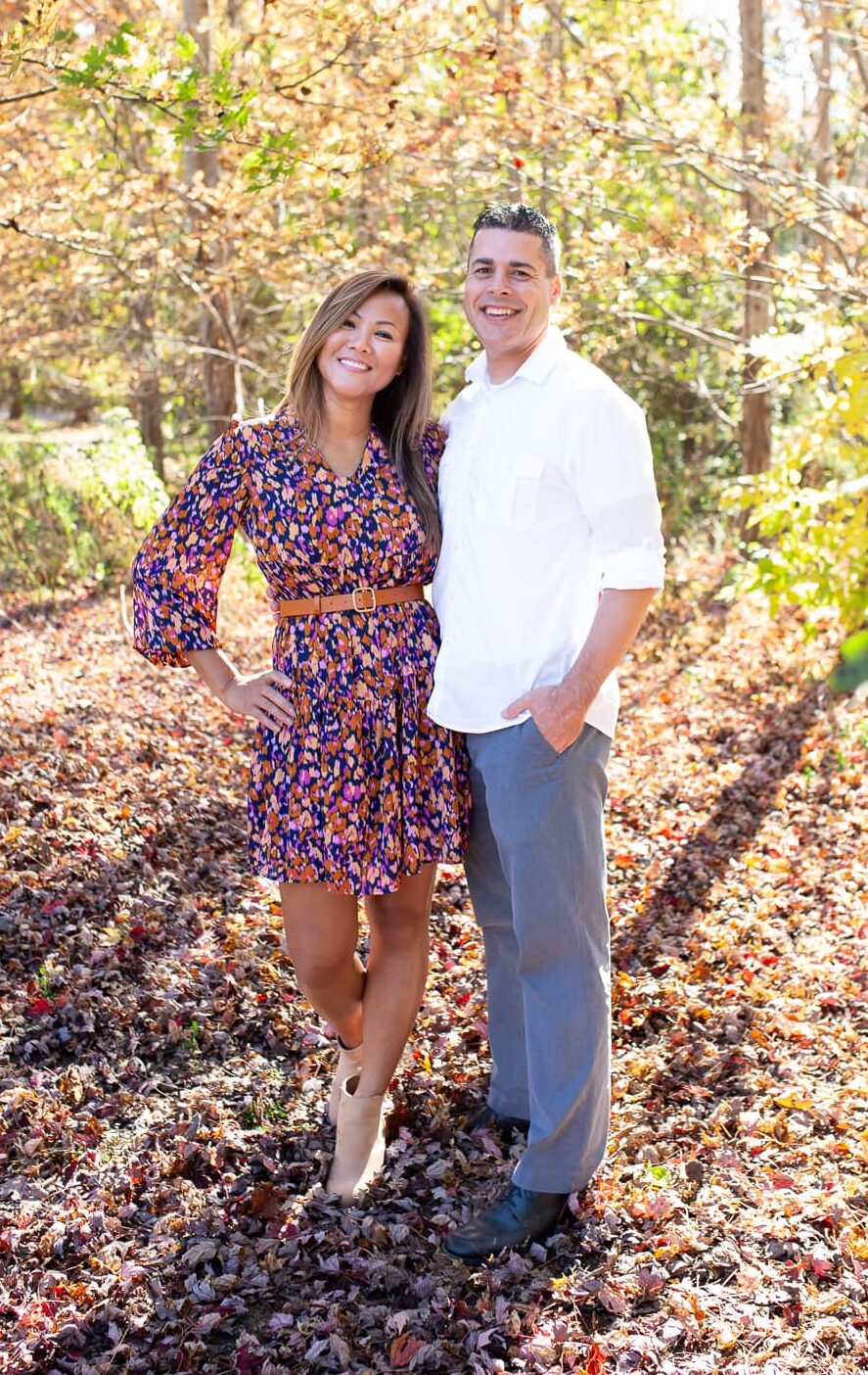 husband and wife posing for a photo during fall mini session 