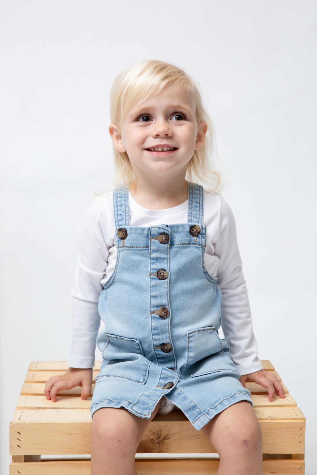 adorable toddler girl smiling. in-studio kids photos wake forest