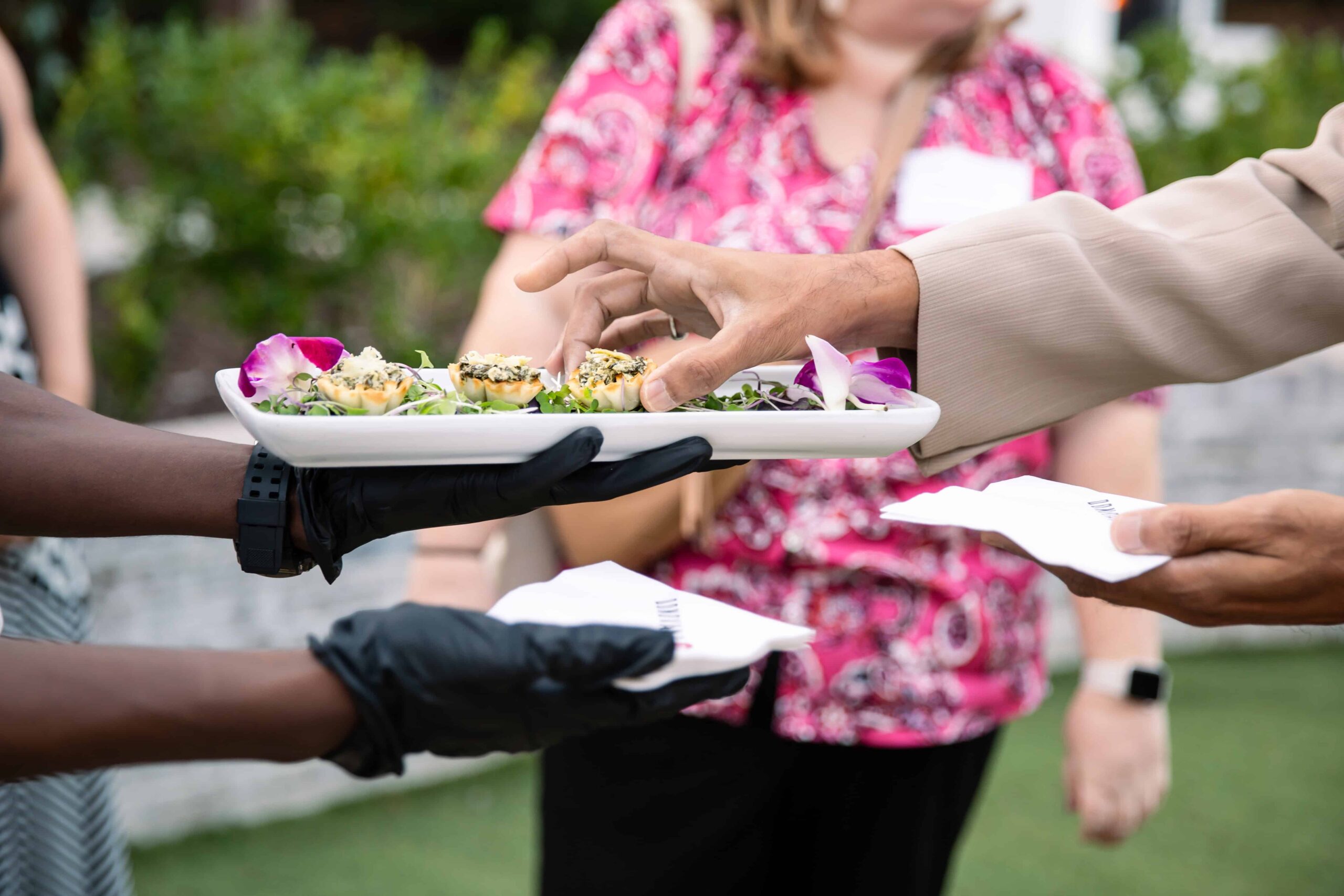 Man's hand is reaching for an appetizer. Event Photography Raleigh, NC