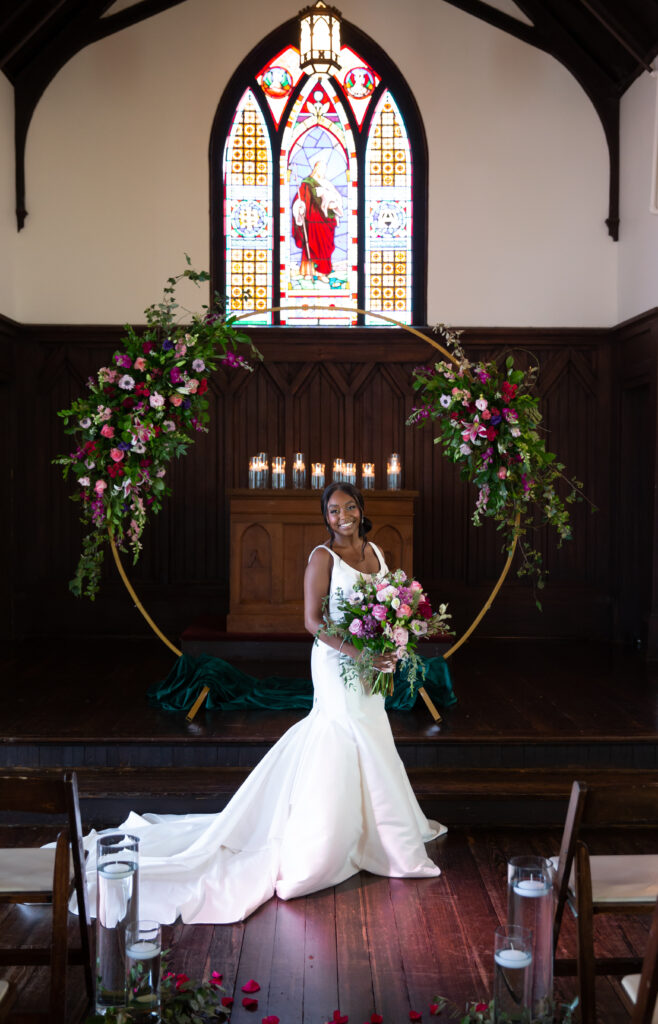 Bride portrait at the altar inside All Saints Chapel in Raleigh NC