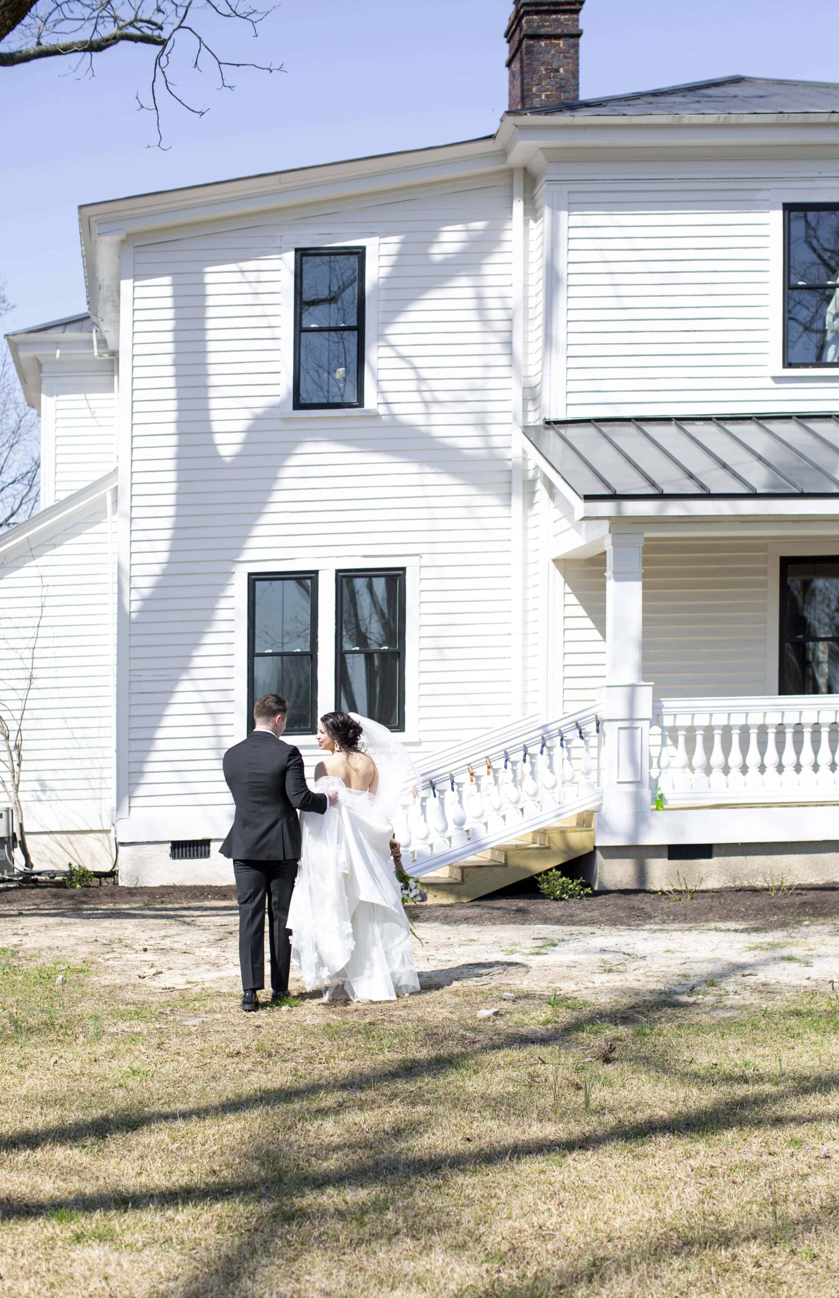 Newlyweds walking towards the historic home at Landon Estate captured by Landon Estate wedding & elopement photographer.