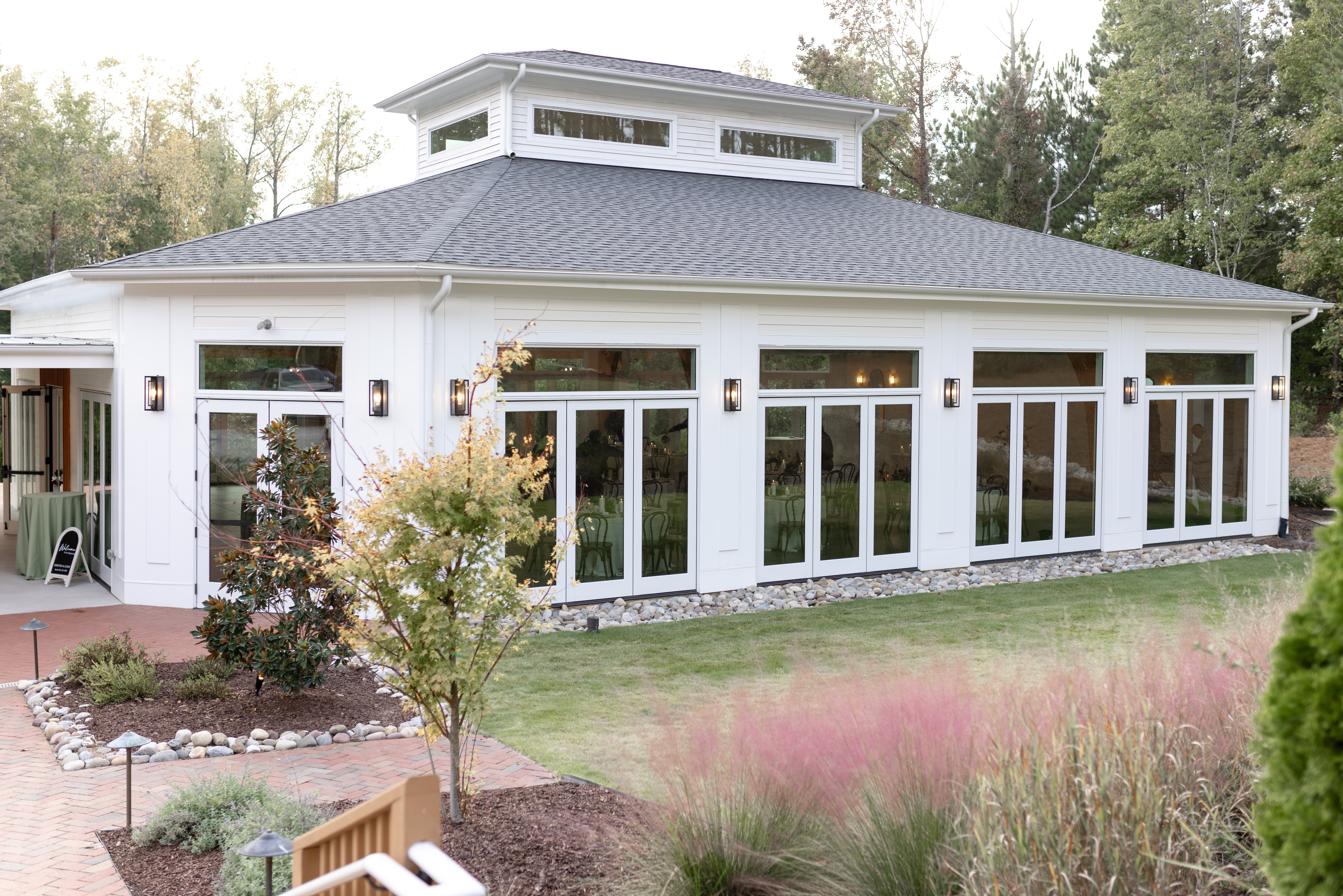 The Conservatory, a light-filled, modern pavilion designed for indoor ceremony and/or wedding reception at the Upchurch venue in Cary, NC. The Upchurch in September.