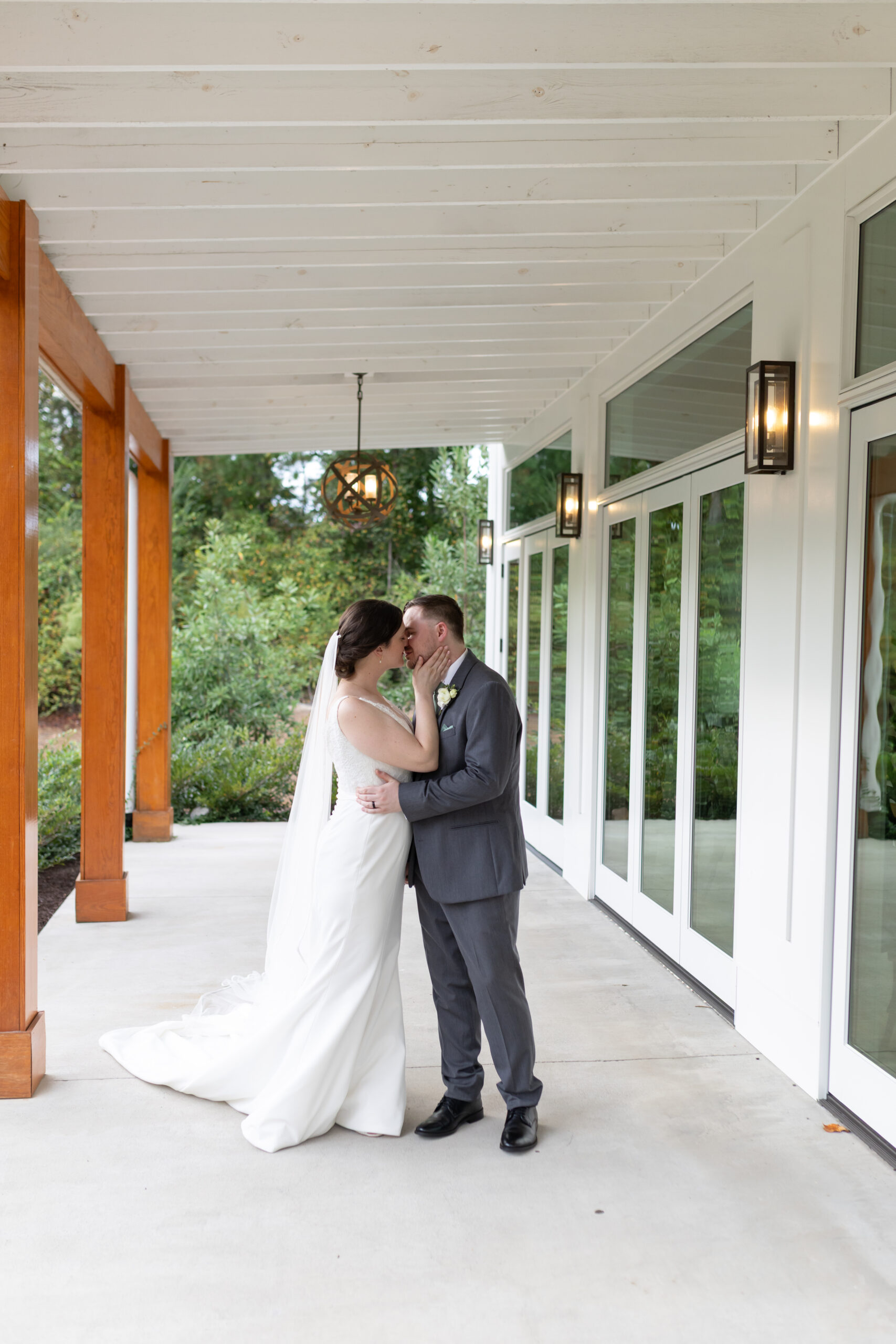 Newlyweds' kiss after their wedding ceremony in Cary, NC captured by Raleigh wedding photographer
