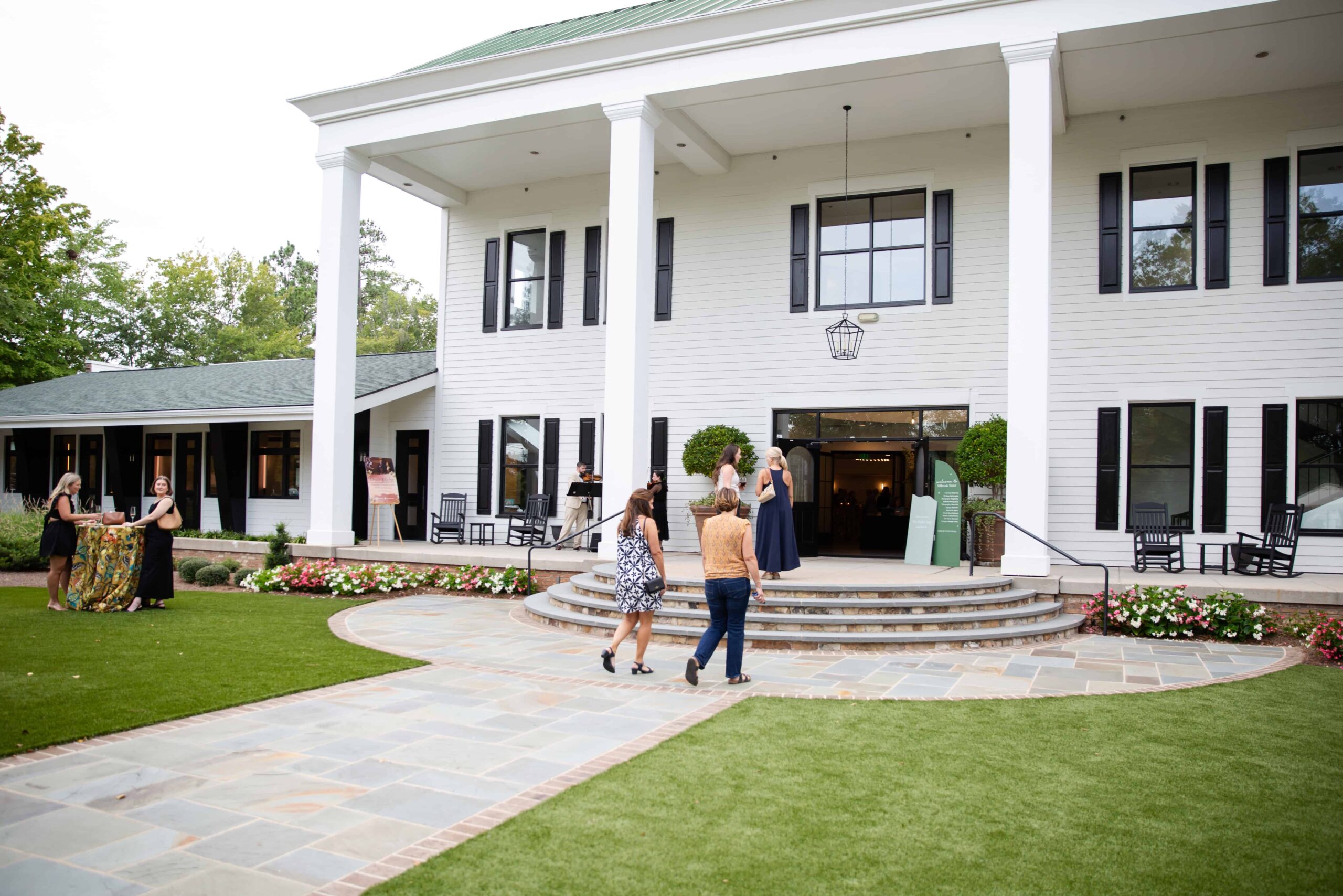 Millbrook Manor venue outside view. Corporate event guests walking into Millbrook Manor Raleigh.