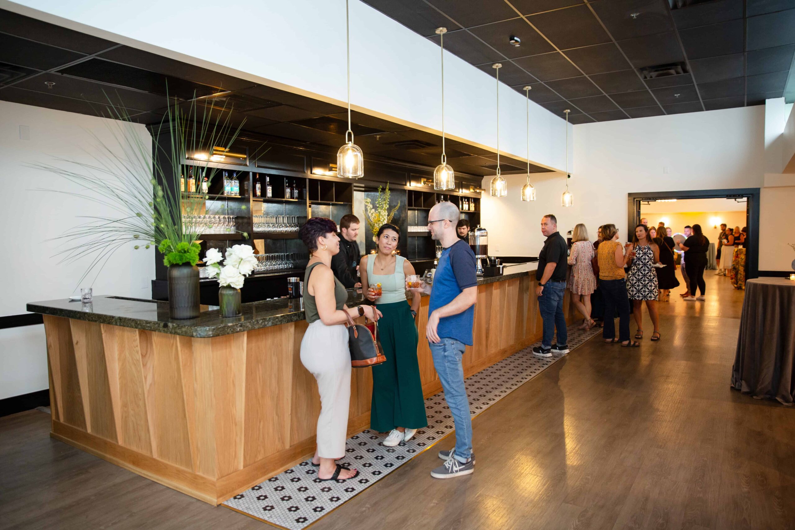 Guests mingling inside Millbrook Manor Raleigh, NC by Raleigh event Photographer.