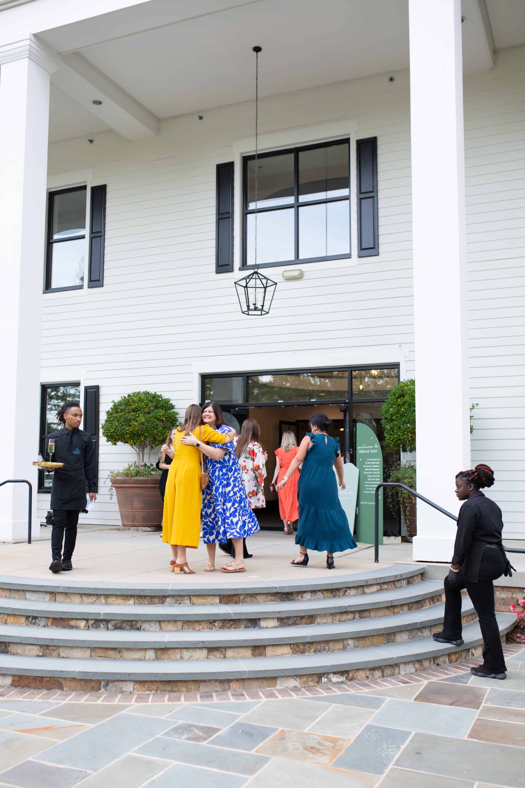 Guests entering the Millbrook Manor captured by Raleigh Event Photographer