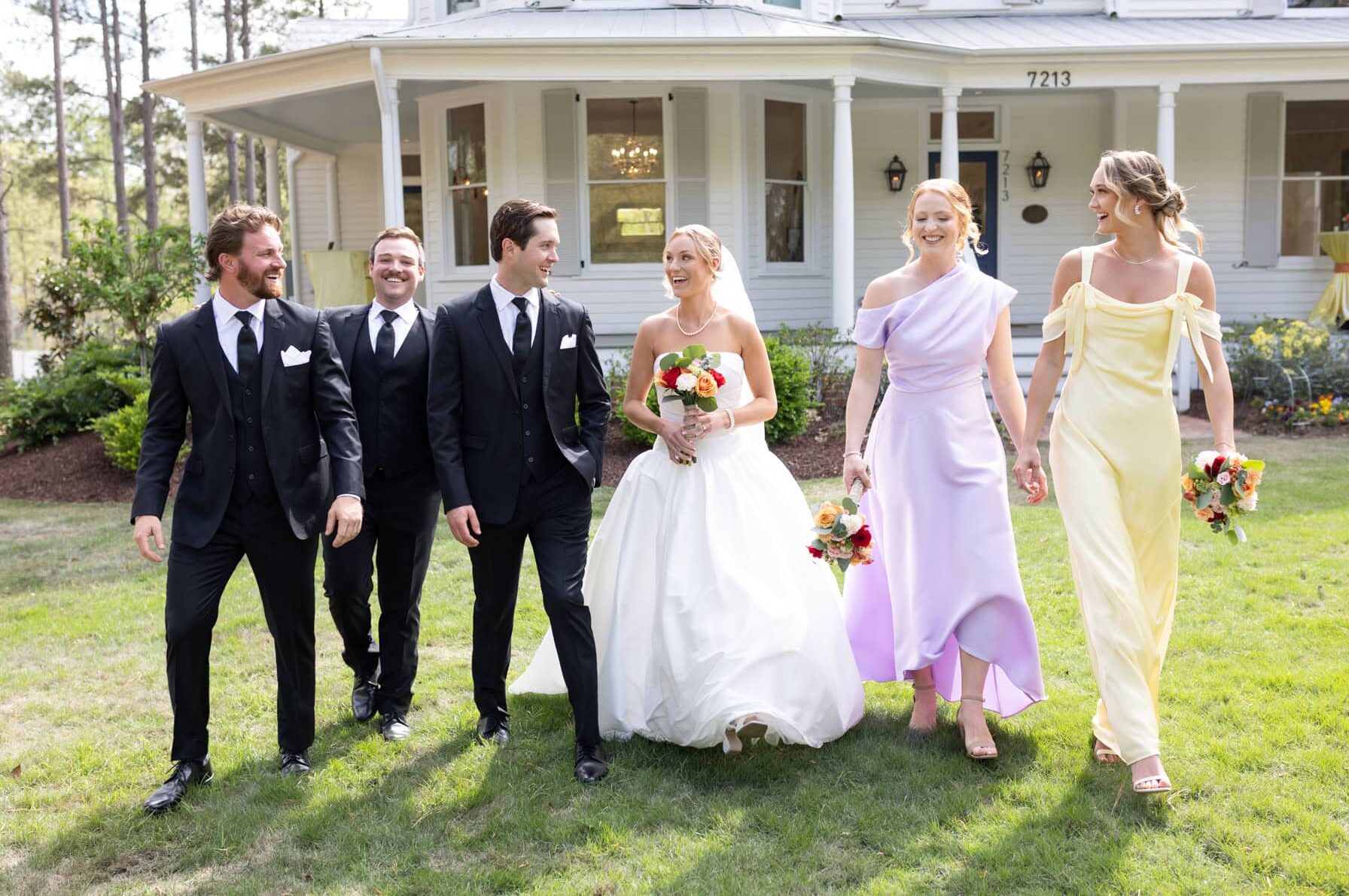 Wedding party candid moment in front of the upchurch by the upchurch wedding photographer.