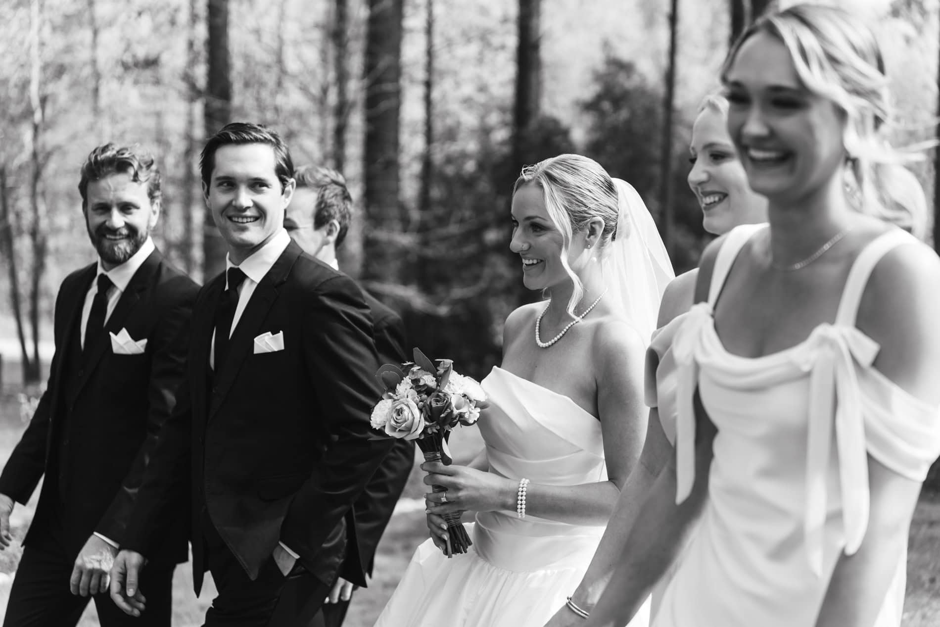 wedding party walking and laughing