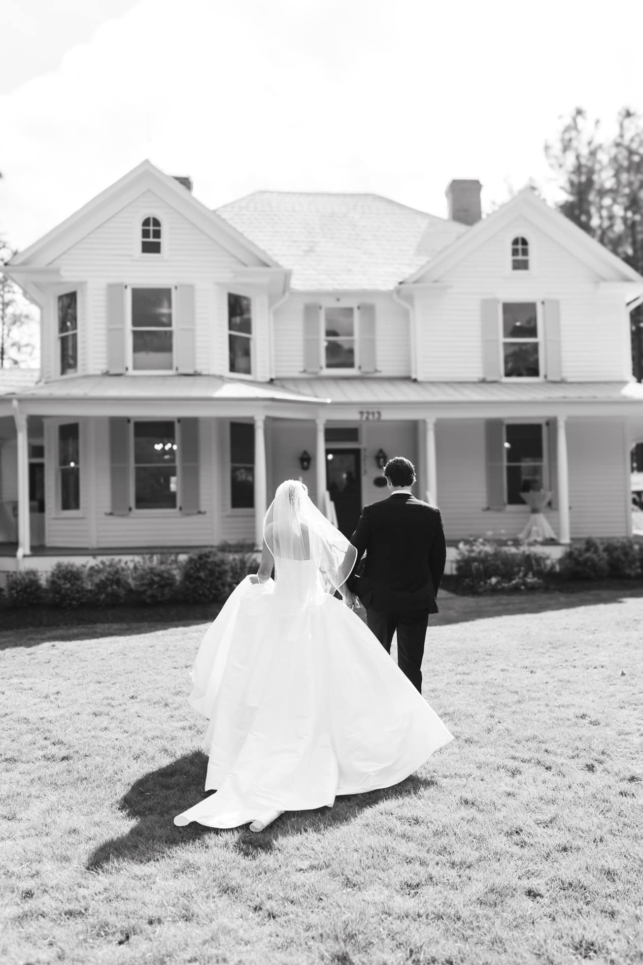 the Upchurch editorial photographer. Newlyweds walking towards the Upchurch house.