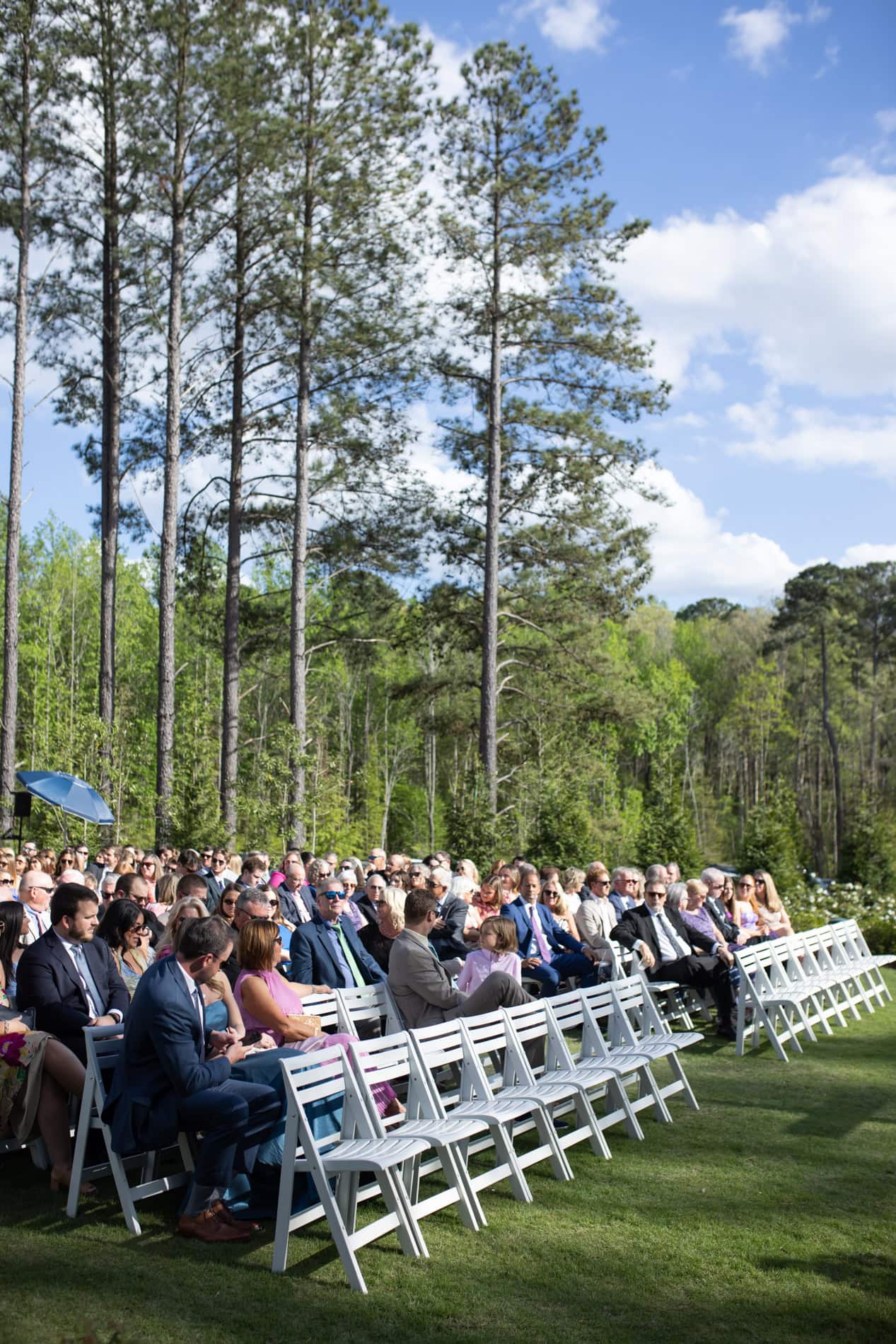 wedding guests waiting for the wedding ceremony to begin on the Magnolia Lawn at the Upchurch.