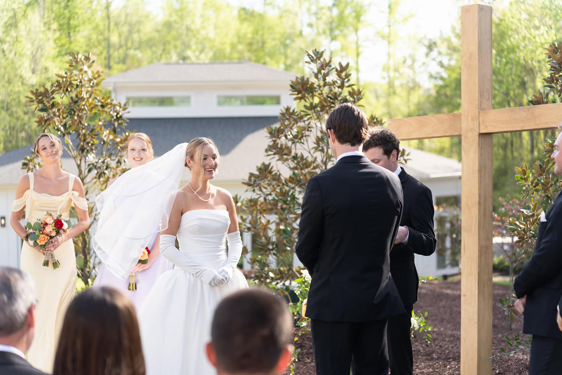 Bride and Groom in their wedding attire exchanging vows.