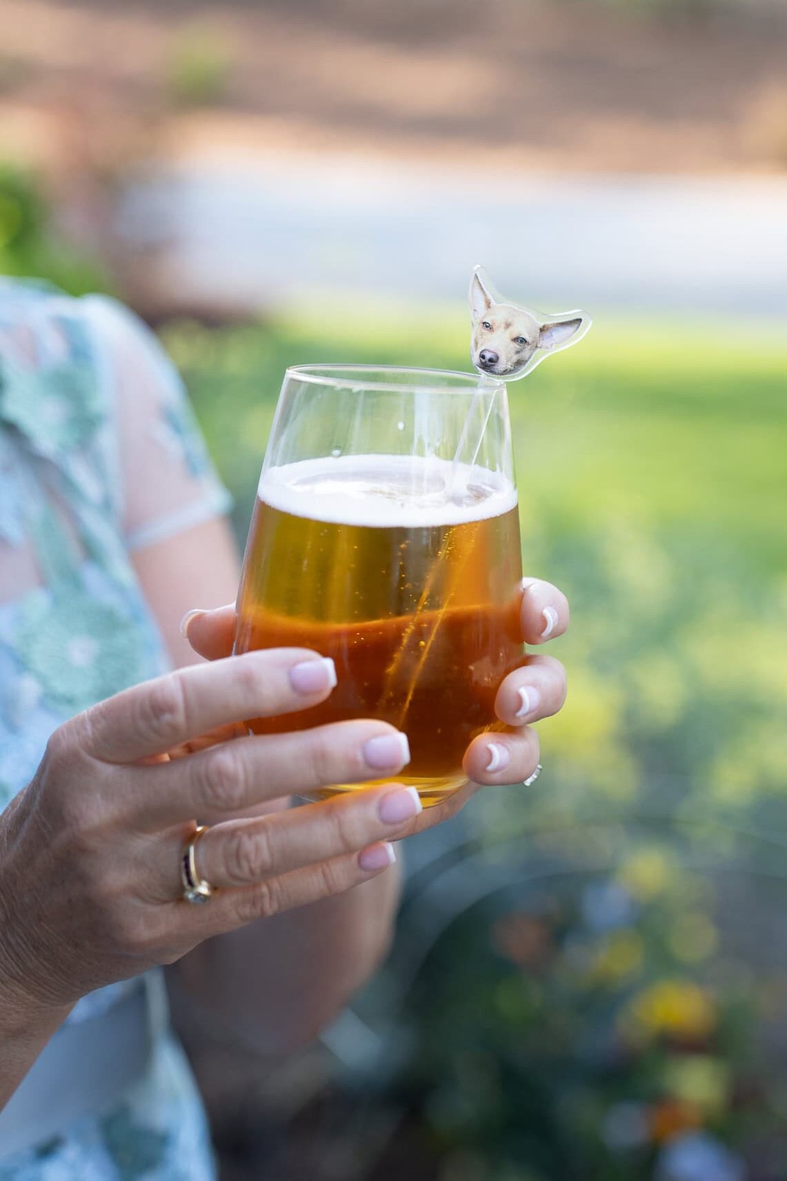 mother of the bride holding a glass with a custom drink