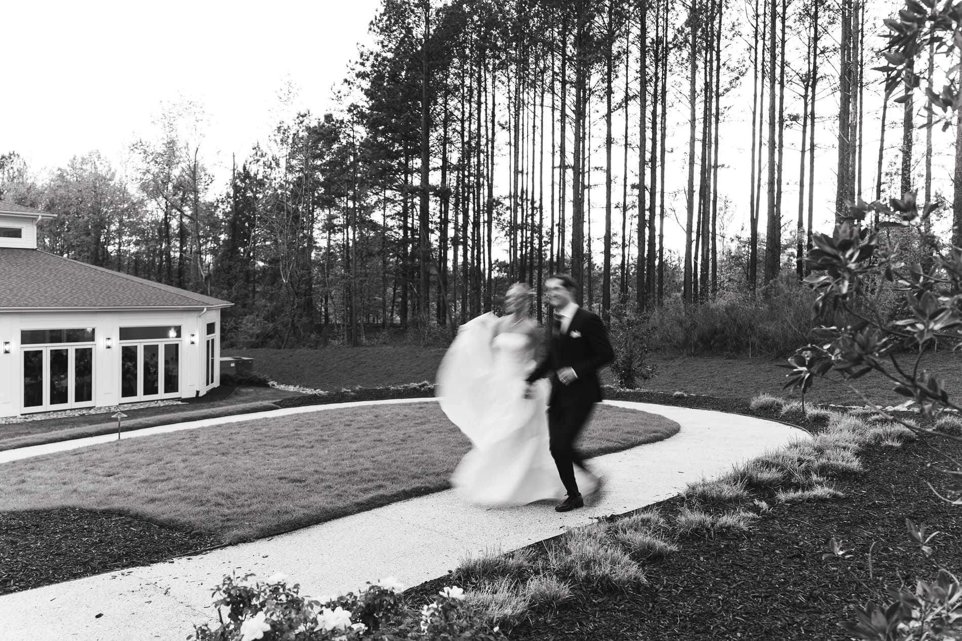 Editorial style portriat of the bride and groom running at the Upchurch. Blurry wedding photos. Intentional Blur wedding photos. Editorial wedding photography in Raleigh, NC.