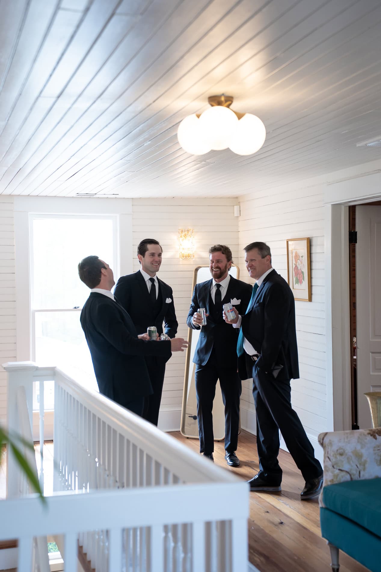 Groom and groomsmen in front of the getting ready suite at the Upchurch historic home.