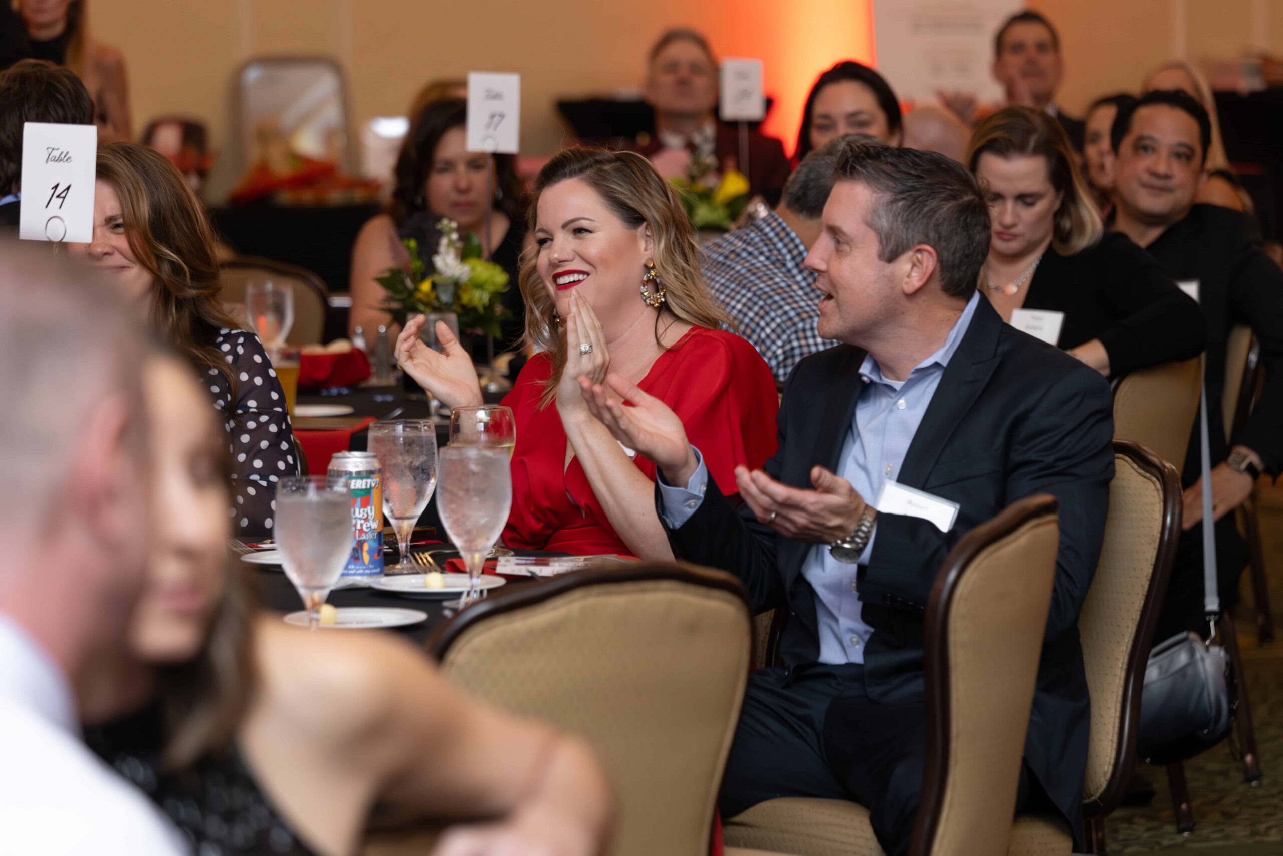 Guests applauding the speaker at North Ridge Country Club in Raleigh, NC durning a corporate event.