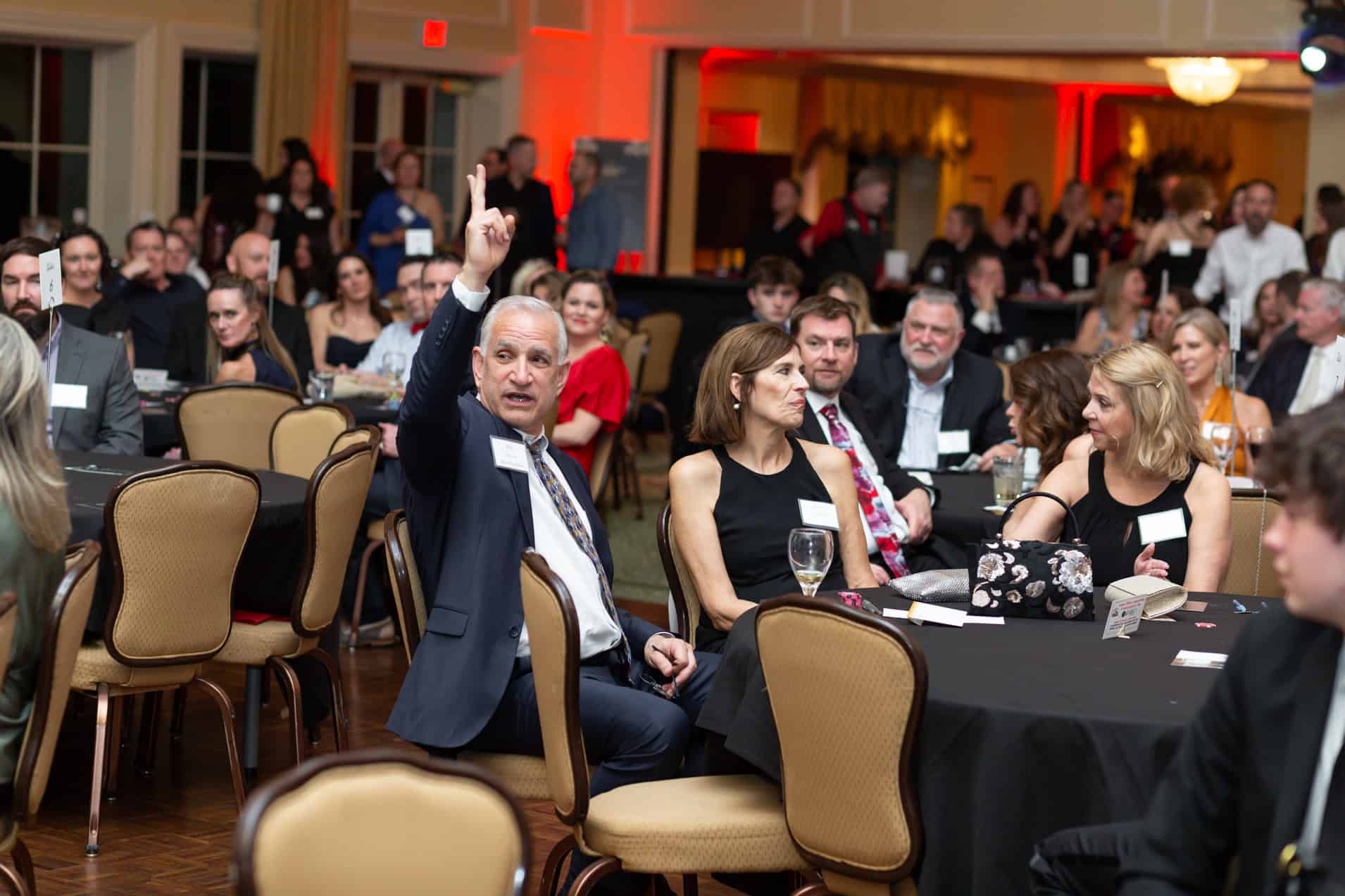 live auction bidder at North Ridge Country Club in Raleigh, NC charity event