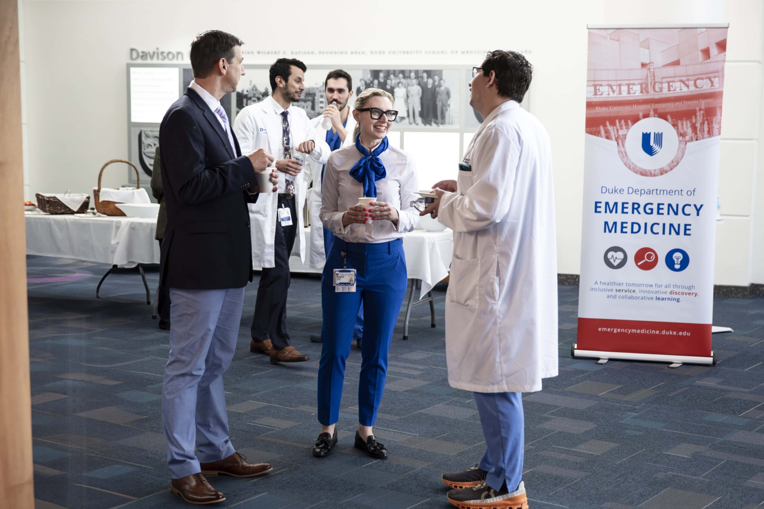 doctors mingling during company event. 