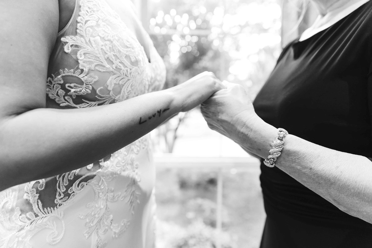 Close up on Bride's tatto on wrist.