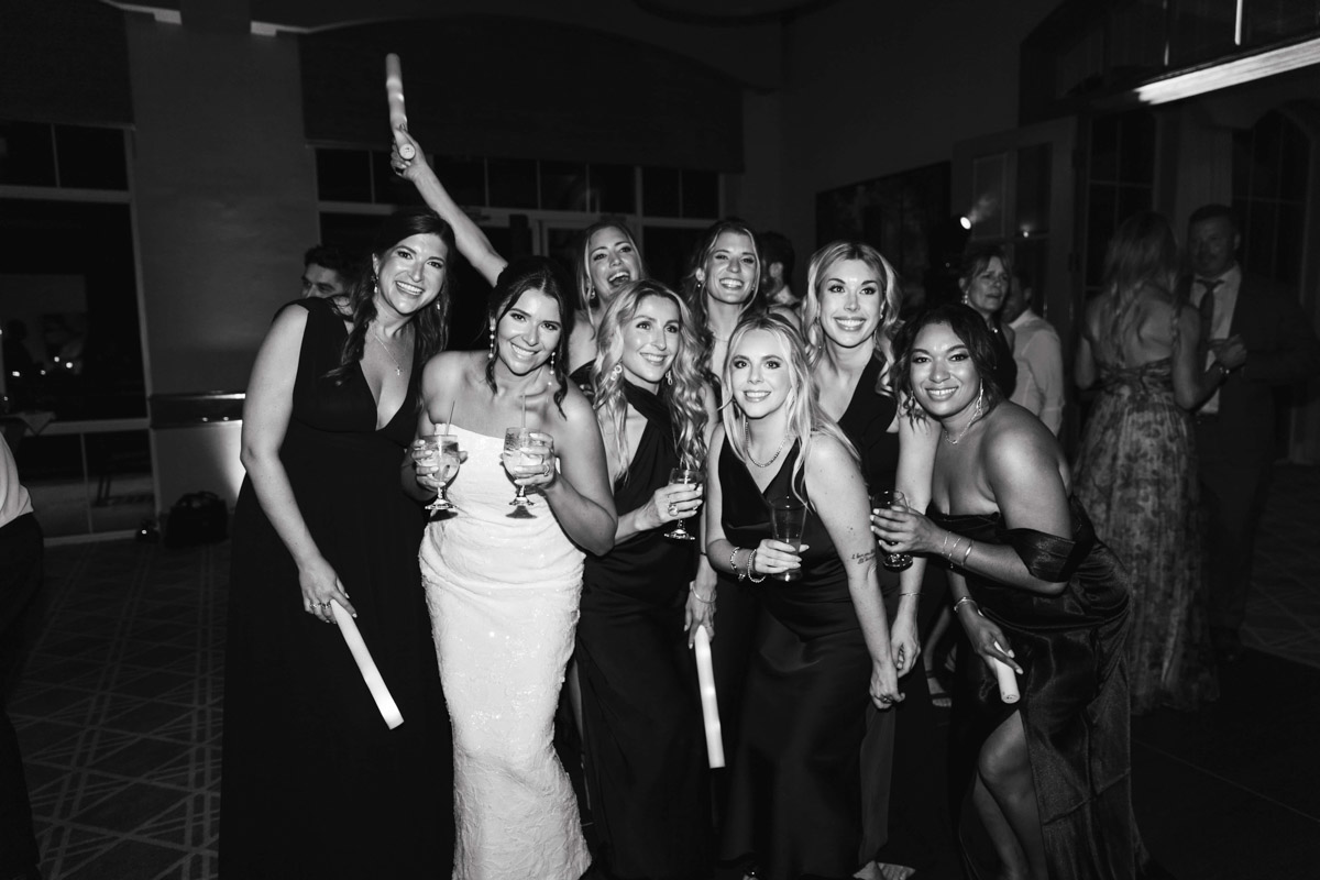 Black and white photo of Bride and her friends, captured by Durham wedding photographer. 